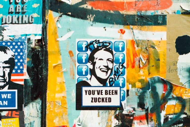 Graffiti art on wall makes political commentary about Mark Zuckerberg