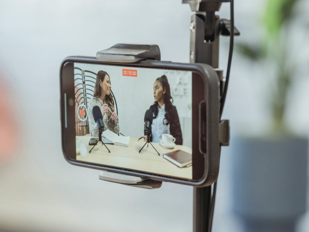 Using a mobile phone for live streaming a conversation