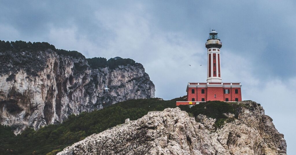Lighthouse perched on sea cliffs