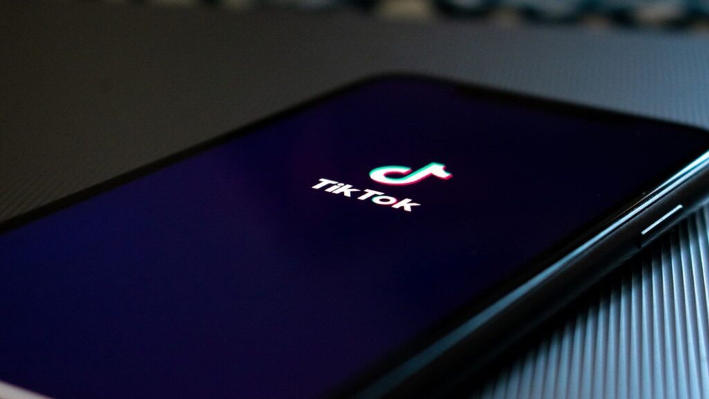 Close up photo of a phone loading TikTok app.