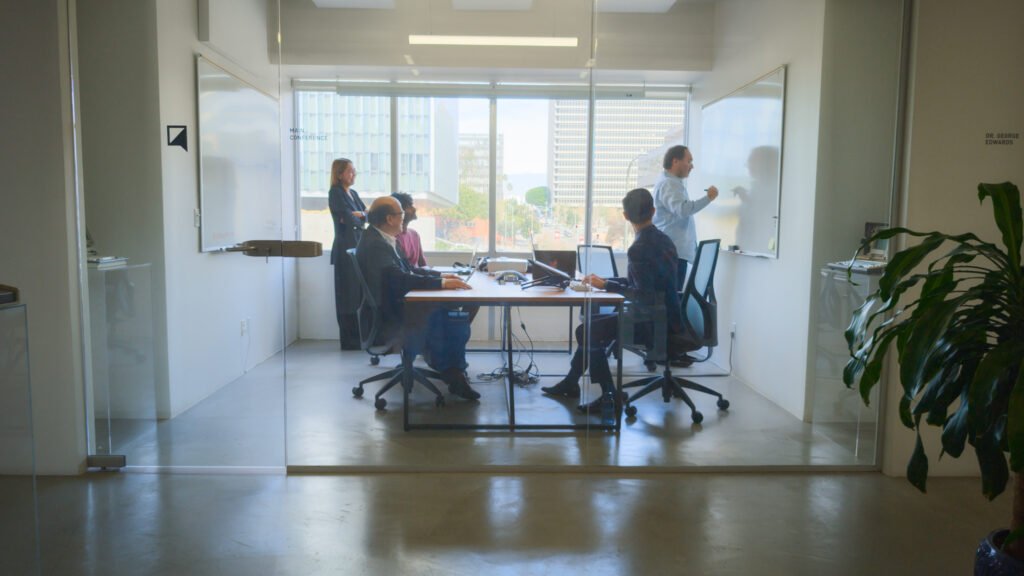 Candid photo of experts from the QPR team working at the Los Angeles office.